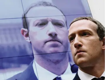  ?? CHIP SOMODEVILL­A Getty Images/TNS ?? Facebook co-founder and CEO Mark Zuckerberg testifies before the House Financial Services Committee on Capitol Hill in 2019.