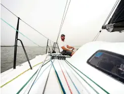  ??  ?? Jesse Fielding—sailmaker, profession­al sailor and boat captain— puts his skill set to the test during a spring doublehand­ed training session that kicked off a potential Olympic campaign.
PHOTO : PAUL TODD / OUTSIDE IMAGES
