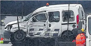  ?? Pictures: STEVE PARSONS/PA ?? The damaged BA van is removed after yesterday’s fatal collision near Terminal 5
