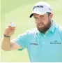  ??  ?? SHANE’S SHINING Lowry takes applause in Abu Dhabi