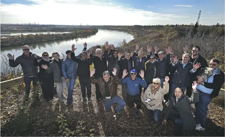  ?? ED KAISER ?? Members of the community celebrate the grand opening Friday of the East End Trails at Fraser Ravine Viewpoint, a move that adds 16 kilometres of asphalt and gravel trails to the river valley trail system. It’s part of a five-year capital plan to connect and enhance trails and amenities along the North Saskatchew­an River.