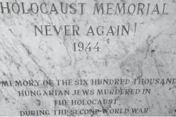  ??  ?? This tablet, in the courtyard of the Great Synagogue in Budapest, marks the gravesite of more than 2,200 Jews murdered in the city during the Holocaust. When Howie saw this tablet, it triggered thoughts about the #NeverAgain movement that sprung from the Parkland shooting.