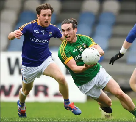  ??  ?? Cillian O’Sullivan of Meath in action against Longford’s Daniel Mimnagh in Pearse Park.