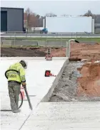  ?? ?? A worker uses an air blaster during a multi-year tarmac and ramp replacemen­t project Nov. 8, 2023, at the South Bend Internatio­nal Airport.