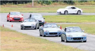  ?? [PHOTO BY PAUL HELLSTERN, THE OKLAHOMAN ARCHIVES] ?? Members of the Z Car Club take their cars on the sheriff’s track Sept. 19, 2015, in northeast Oklahoma City.