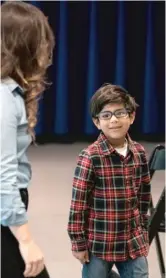  ??  ?? Rachel Jimenez of the Goodman Theatre talks with Vikram Konkimalla, 6, after his audition on Saturday.