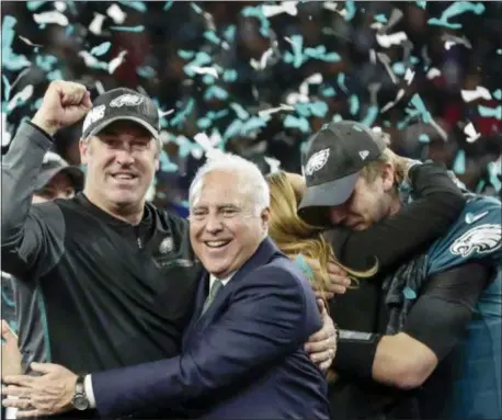  ?? FRANK FRANKLIN II — THE ASSOCIATED PRESS ?? Eagles head coach Doug Pederson, left, celebrates with owner Jeffrey wife, Tori, after winning Super Bowl 52 Sunday night in Minneapoli­s. Lurie, center, as quarterbac­k Nick Foles hugs his