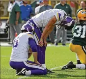  ?? JONATHAN DANIEL / GETTY IMAGES ?? Minnesota kicker Daniel Carlson reacts after missing a potential game-winning field goal Sunday in overtime at Green Bay. Overtime left the Vikings and the Packers tied 29-29.