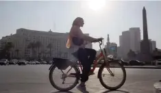  ?? A woman rides a bike in Cairo, Egypt. — Reuters ??