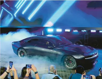  ?? CARLOS OSORIO/AP ?? The Dodge Charger Daytona SRT, a battery-powered concept car, is unveiled Wednesday in Pontiac, Michigan.