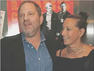  ?? AP PHOTO ?? In this Aug. 22, 2007, file photo, Harvey Weinstein and Donna Karan are seen at the Paris Theater in New York. Karan apologized after offering praise for Weinstein following his firing from his company amid allegation­s of sexual harassment lasting...