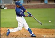  ?? MARK J. TERRILL / AP ?? The Dodgers’ Mookie Betts hits during intrasquad play July 6 in Los Angeles. The Dodgers open the season at home on July 23 with a four-game series against the Giants.