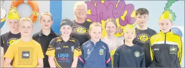  ?? ?? Coach Jackie with some of her swimmers who took part in the recent Premier Invitation­al Gala in Thurles.