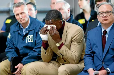  ?? PHOTO: AP ?? James Shaw wipes away tears at a press conference on the Waffle House shooting yesterday in Nashville. To Shaw’s right is Nashville Metro Mayor David Briley and to his left is FBI Special Agent in Charge Matthew Espenshade.