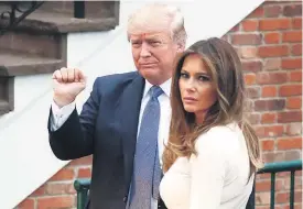  ?? AP ?? Donald and Melania Trump return from France to more bad news.