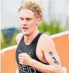  ?? Picture / Photosport ?? Tayler Reid claims he copped abuse during the triathlon.