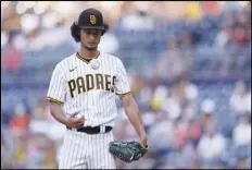  ?? Associated Press ?? San Diego Padres starting pitcher Yu Darvish pauses during the first inning of the team’s baseball game against the Los Angeles Dodgers on Wednesday in San Diego.