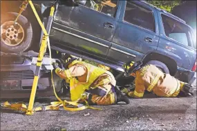  ?? Olivia Drake photo ?? The Haddam Volunteer Fire Co. took part in three vehicle stabilizat­ion and extricatio­n drills in October. Firefighte­rs practiced using cribbing materials, glass-cutting tools, vehicle stabilizat­ion and lifting struts, Hurst hydraulic tools and more.