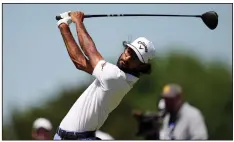  ?? (AP/Eric Gay) ?? Akshay Bhatia hits a tee shot on the fourth hole during the first round of the Texas Open on Thursday in San Antonio. Bhatia leads after shooting a 9-under 63.