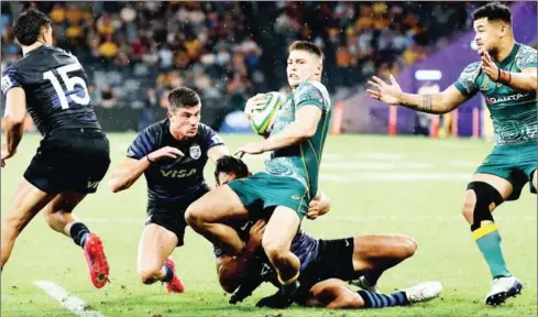  ?? AFP ?? Australia’s James O’Connor (centre) is tackled by Argentina’s Matias Orlando during the 2020 Tri-Nations rugby match between the Australia and Argentina in Sydney on Saturday.