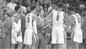  ?? RAYMOND CARLIN III/USA TODAY SPORTS ?? Baylor coach Scott Drew talks with his team during the second half of a game last season. Baylor begins the season at No. 1.