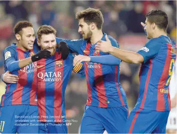  ?? — AFP ?? Barcelona’s Lionel Messi (second left) celebrates with team-mates at the Camp Nou stadium in Barcelona on Thursday.