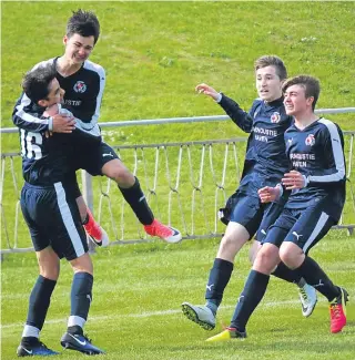  ??  ?? Carnoustie players celebrate scoring their first of four second-half goals as they went on to beat Brechin 4-1 in the Chuck McGowan Cup at North End Park.