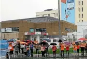  ?? ?? Striking allied health workers brave the weather outside Palmerston North Hospital to raise awareness of their pay claim.