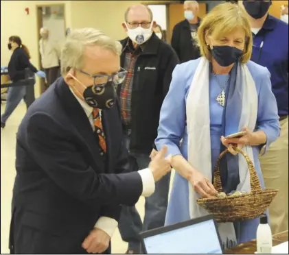  ??  ?? Governor Mike and First Lady Fran Dewine stopped in Lima Friday to visit the vaccinatio­n site set up at the former Knights of Columbus hall in Lima. The first lady brought Easter-themed treats to share with the health care workers.