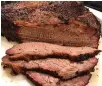  ?? Tribune News Service ?? ■ It took eight hours or so to make, but beef brisket cooked in a kamado grill was worth it.