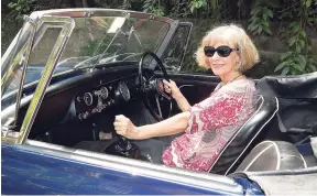  ??  ?? Prudence Lovell in her 1968 MG Midget.