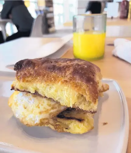  ?? JASON K. WATKINS/FOR THE JOURNAL ?? Breakfast sandwich is served with egg, cheese, pork sausage on a homemade buttermilk biscuit at Modern General.