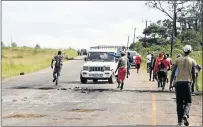  ??  ?? NO HOLDING BACK: Angry villagers in Gwiqi Village in Potsdam embarked on a violent service delivery protest, which ended with eight people being arrested for causing public violence