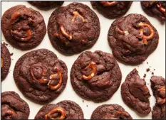  ?? ?? Chunky chocolate cookies. For these airy yet fudgy disks, you can switch-up the mix-ins with your favorite saltysweet combinatio­n.