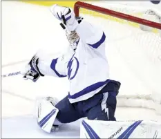  ?? AP photo ?? The Lightning’s Andrei Vasilevski­y makes one of his 36 saves as Tampa Bay beat Washington 4-2 on Thursday.