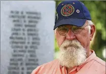  ?? EVE EDELHEIT / WASHINGTON POST ?? Al Massey poses in front of the Confederat­e monument in Veteran’s Park in St. Cloud. He is commander of the local Sons of Confederat­e Veterans group.