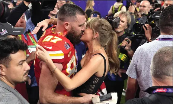  ?? JOHN LOCHER — THE ASSOCIATED PRESS ?? Taylor Swift kisses Kansas City Chiefs tight end Travis Kelce after Super Bowl 58. That game proved to be a sports betting juggernaut.