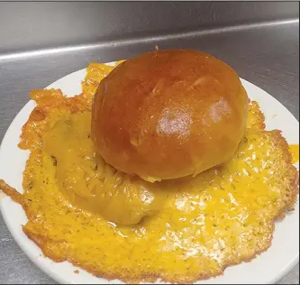  ?? SPECIAL THANKS TO NWA MEDIA ?? One of the non-seafood favorites is the ‘Cheddar Bomb’ which is a burger covered in Cheddar cheese.