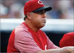  ?? THE ASSOCIATED PRESS ?? In this file photo, Cincinnati Reds manager Bryan Price reacts after starting pitcher Scott Feldman walks Colorado Rockies’ Carlos Gonzalez to put two runners on base in the first inning of a baseball game, in Denver. The Reds have fired Bryan Price...