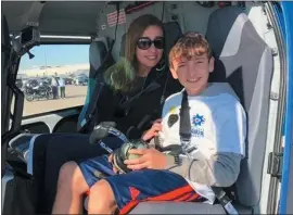  ?? COURTESY OF COPS CARE CANCER FOUNDATION ?? Grand Marshal Tyler Murray, 12, and his mom, Carmen Murrary-Hernandez, sit in a helicopter during the Cops Care Cancer Foundation’s 15th annual Fantasy Flight event on Dec. 8.