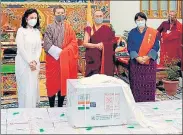  ??  ?? Bhutan PM Lotay Tshering (2nd from right) on the arrival of a consignmen­t of Covid-19 vaccine in Bhutan.