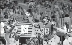  ?? David Goldman /
The Associated Press ?? Atlanta’s Akeem King (right) goes up for a pass intended for Jacksonvil­le’s Dede Westbrook.