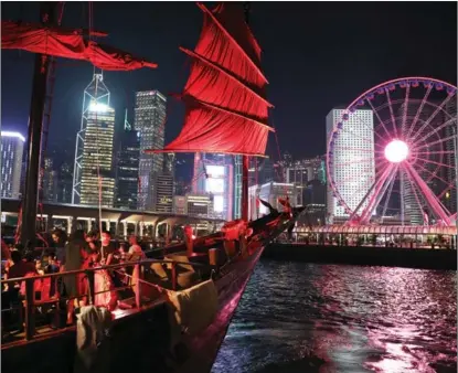  ?? WU XIAOCHU / XINHUA ?? A tourist junk boat sails to Central harbourfro­nt in Hong Kong in this photo filed on Oct 7. Hong Kong has embraced a calmer and more stable time about 100 days after the implementa­tion of its National Security Law despite accusation­s by some Western politician­s.