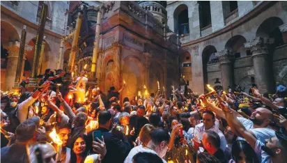  ?? ?? ORTHODOX CHRISTIAN worshipers during the miracle of the Holy Fire ceremony in the Church of the Holy Sepulcher yesterday. (Olivier Fitoussi/Flash90)
