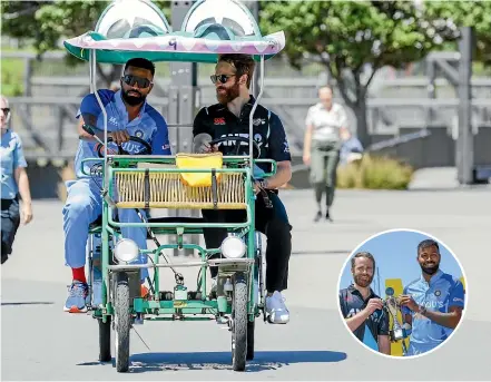  ?? GETTY IMAGES ?? Indian T20 skipper Hardik Pandy, left, and Black Caps captain Kane Williamson arrive on a crocodile bike ahead of a media opportunit­y in Wellington yesterday. Inset, Williamson and Pamdy with the T20 trophy.