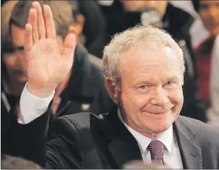  ?? PETER MORRISON/THE ASSOCIATED PRESS FILE PHOTO ?? Martin Mcguinness waves to the media while waiting to hear the results in the first count in the presidenti­al election at Dublin Castle, Ireland, Oct. 28, 2011. Mcguinness, an IRA and Sinn Fein leader who became a minister of peacetime Northern...