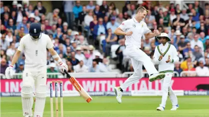  ??  ?? NOTTINGHAM: South Africa’s Chris Morris (R) celebrates taking the wicket of England’s Mark Wood (L) for 6 runs on the second day of the second Test match between England and South Africa at Trent Bridge cricket ground in Nottingham, central England...