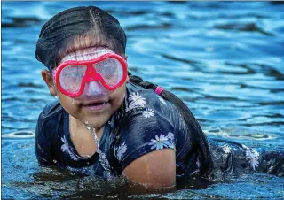  ?? TERRY PIERSON — STAFF PHOTOGRAPH­ER ?? Out in the water: A swimmer comes up for a breath as she enjoys the cool waters of Lake Hemet in Mountain Center on July 16.