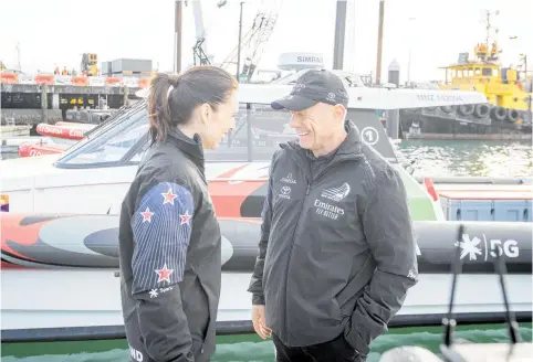  ?? Photo / Michael Craig ?? Jacinda Ardern and Grant Dalton celebrate the 2019 launch of an Emirates Team NZ yacht.