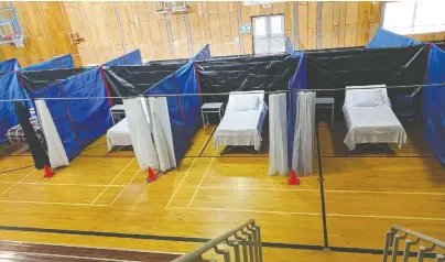  ??  ?? These beds in Bella Bella were created in a gym by the Heiltsuk Tribal Council as an emergency measure in case of a COVID-19 outbreak. A coalition of First Nations is challengin­g B.C. over its position to not share with them virus case informatio­n such as location and proximity.